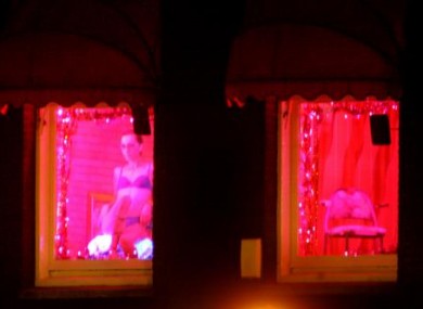 A prostitute in Amsterdam's 'red light district'