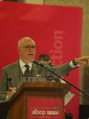 Auctioneer Garry Murphy conducting the auction in a packed Shelbourne Hotel.