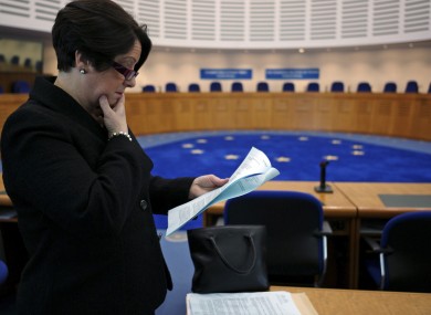 Carmel Stewart, a lawyer for A B and C, reads the ECHR's ruling at its courtroom in Strasbourg.