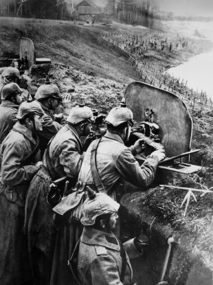 File photo circa 1918 of German soldiers at a trench-mounted machine gun.