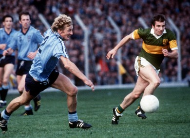 Mick Holden of Dublin and John Egan of Kerry chase a loose ball during a 1984 encounter.