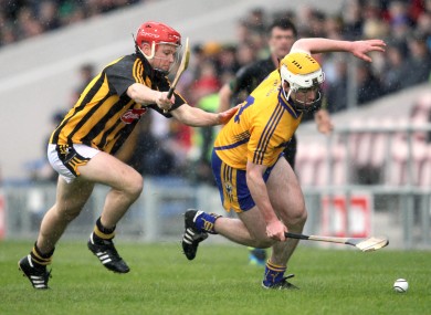 Conor McGrath is chased by Tommy Walsh