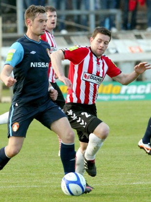 Pat's midfielder Greg Bolger is closed down by Eddie McLaughlin.