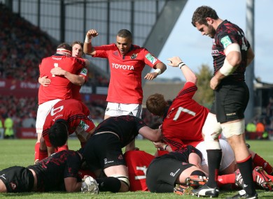 Simon Zebo celebrates Peter O'Mahony's try.