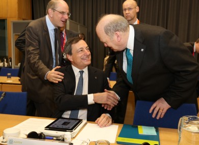 Michael Noonan greets ECB president Mario Draghi ahead of this morning's Eurogroup meeting at Dublin Castle.