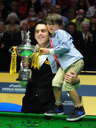 Ronnie O'Sullivan celebrates his trophy win with son Ronnie Jr.