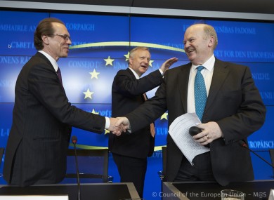 Michael Noonan is congratulated by European Commissioners Algirdas Semeta and Olli Rehn at the conclusion of last week's marathon meeting.