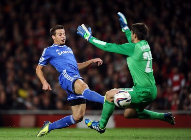 Chelsea's Cesar Azpilicueta (left) scores his teams opening goal ahead of Arsenal goalkeeper Lukasz Fabianski.