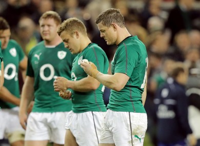 Ian Madigan and Brian O'Driscoll slope off after Ireland were soundly beaten by the Wallabies.