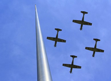 Aircraft from the Irish Defence Forces fly past the Spire on O'Connell Street as part of this year's Easter Rising events