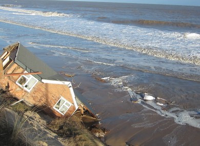 One of five bungalows in Hemsby, Norfolk which fell into the sea last night
