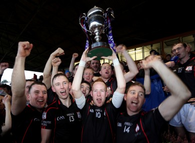 Mount Leinster Rangers Paul Coady lifts the cup.