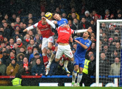 Chelsea's Gary Cahill and Arsenal's Olivier Giroud (left) battle for the ball.