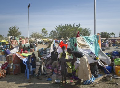 A displaced family sits with their belongings after seeking refuge at the compound of the UN Mission in Juba, South Sudan late last week.