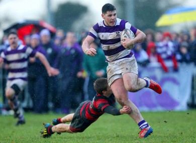 Clongowes Wood's Cian O'Donoghue gets past Liam O'Sullivan of Kilkenny College.