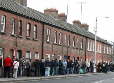 People queue down Cumberland Street, Dun Laoghaire to collect their social welfare payments back in 2009.
