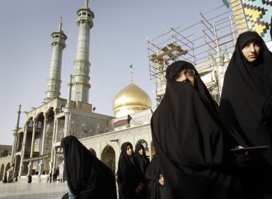 (File photo) Iranian women queue to cast their ballot for the parliamentary elections at Masoumeh shrine in the city of Qom.