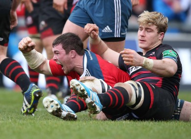 Munster captain Peter O'Mahony celebrates scoring the fourth try.