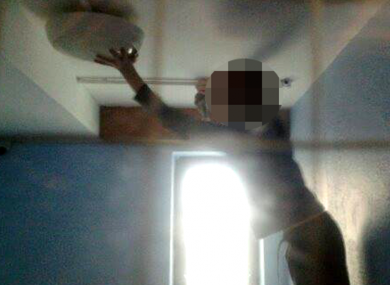 A child locked in a withdrawal room. A member of staff took the photo after the child attempted to dismantle the light after being locked in the room for several hours.