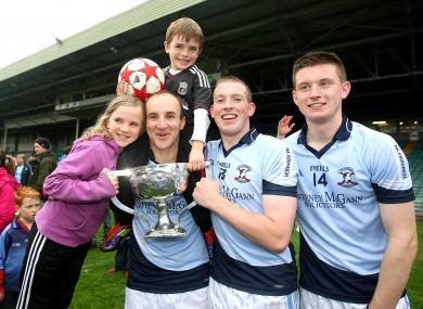 Damien Quigley with his children Emma and Colm, and teammates Shane Dowling and Kevin Downes after the 2011 Limerick county final.