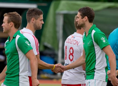Brothers Mark Gleghorne and Paul Gleghorne shake hands before the game in which they play for England and Ireland respectively.